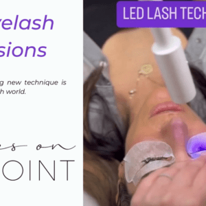 A client receiving LED eyelash extensions with purple curing light applied to the lashes at Lashes On Point salon.